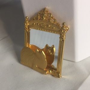 Jonette pin brooch cat looking at his reflection
